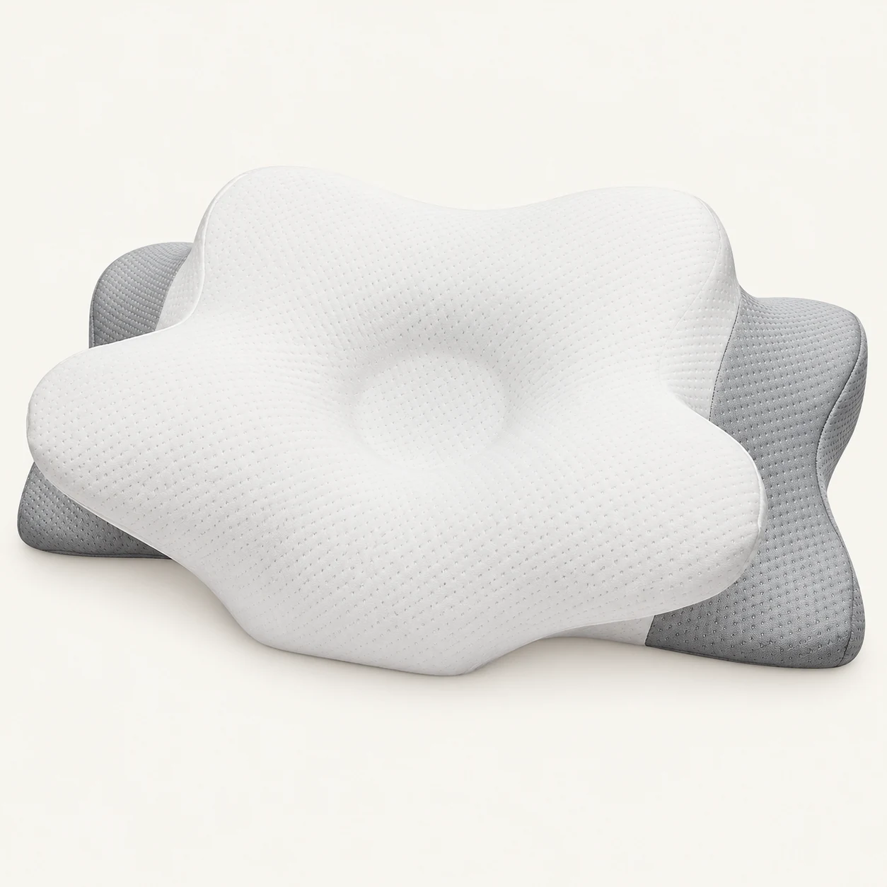 White and light grey sculpted pillow with a shallow central recess