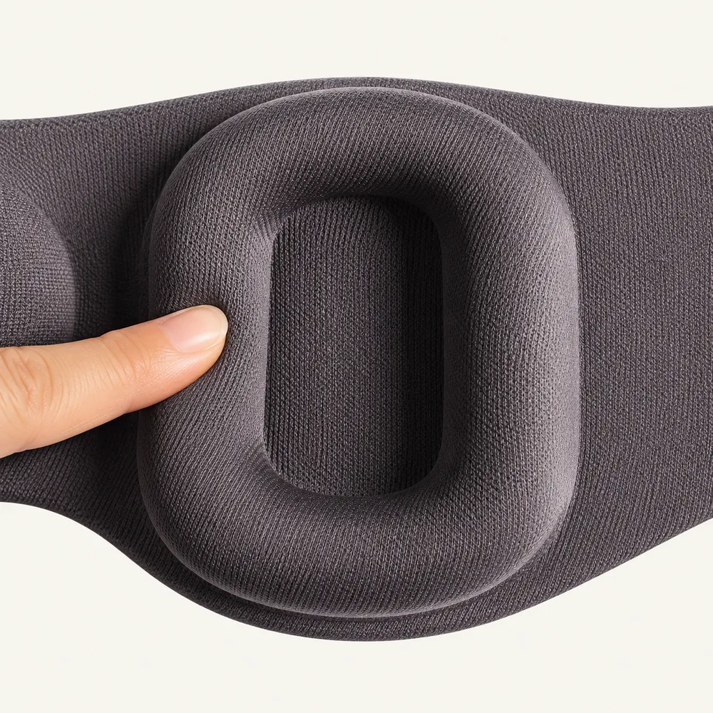 Supplier-detail illustration of a fingertip pressing the fabric-covered edge of a recessed ear cushion