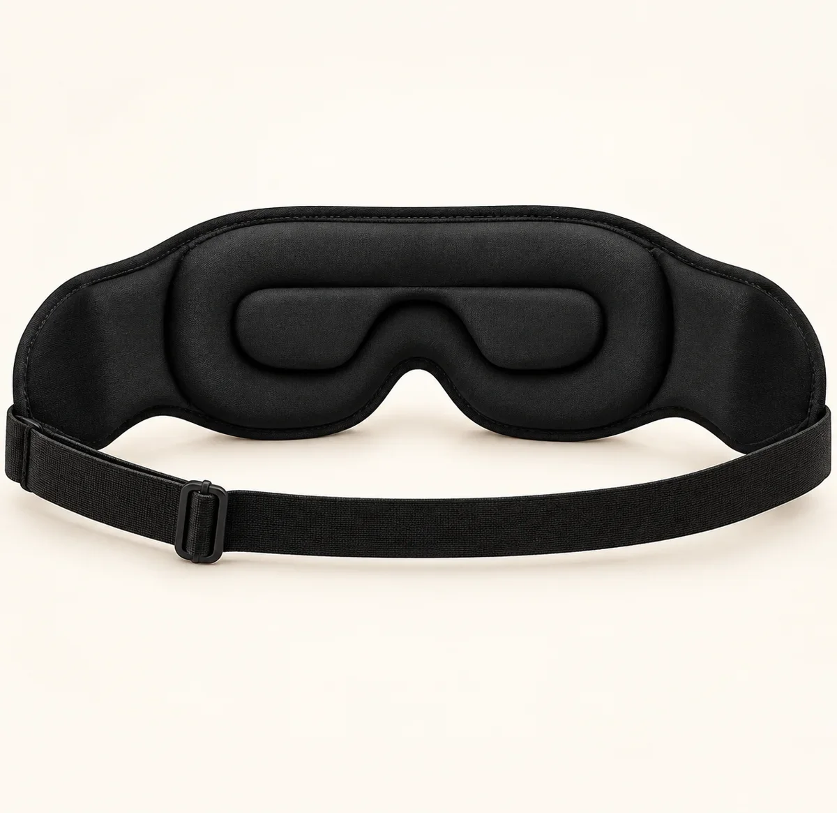 Inside view of the travel eye mask showing eye padding and its adjustable strap